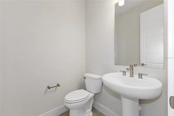 a utility room with cabinets washer and dryer