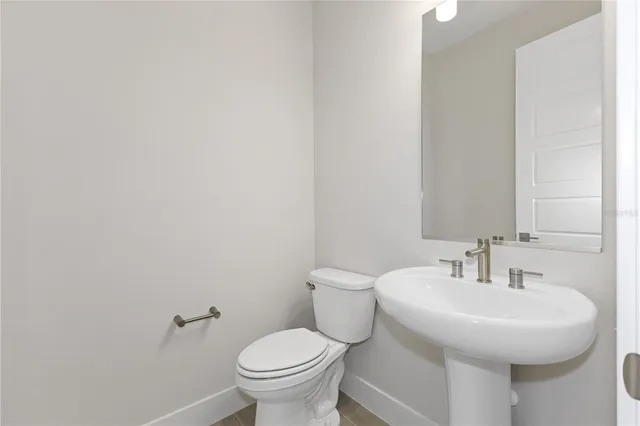 a utility room with cabinets washer and dryer
