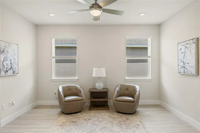 a living room with furniture and a window
