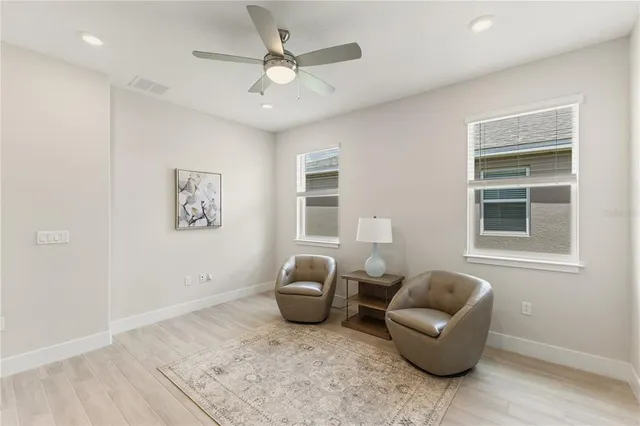 a living room with furniture and a window