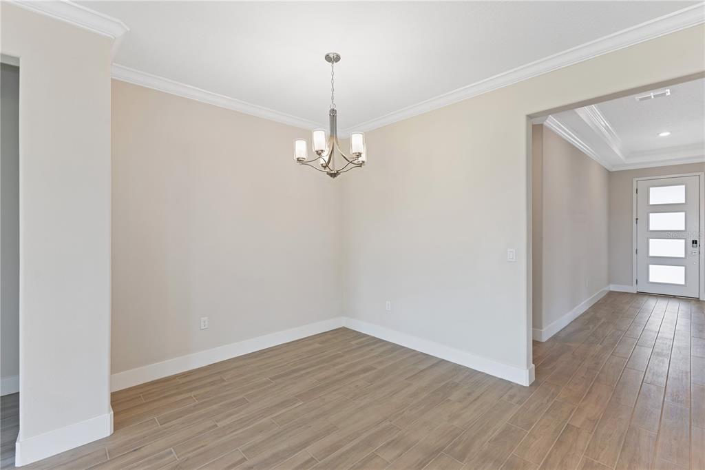 4473 Northwest 53rd Avenue Road Ocala, FL 34482 - Photo 8 of 40 a view of a room with wooden floor and window