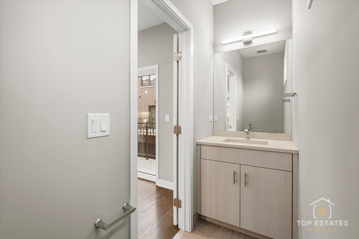 3638 South Western Avenue, Unit F Chicago, IL 60632 - Photo 20 of 36 a bathroom with a sink and mirror