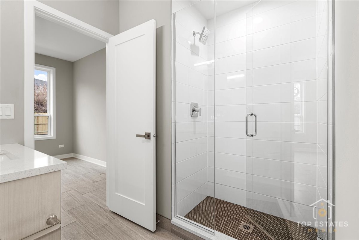 3638 South Western Avenue, Unit F Chicago, IL 60632 - Photo 10 of 36 a bathroom with a shower and a sink