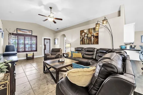 a living room with furniture and a window