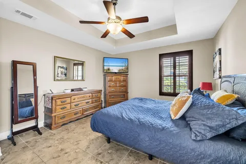a bedroom with a bed and dresser
