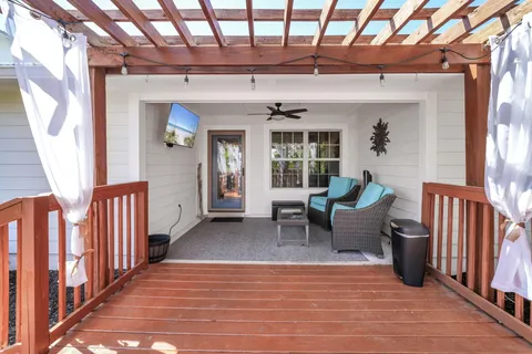 a balcony with furniture and a potted plant
