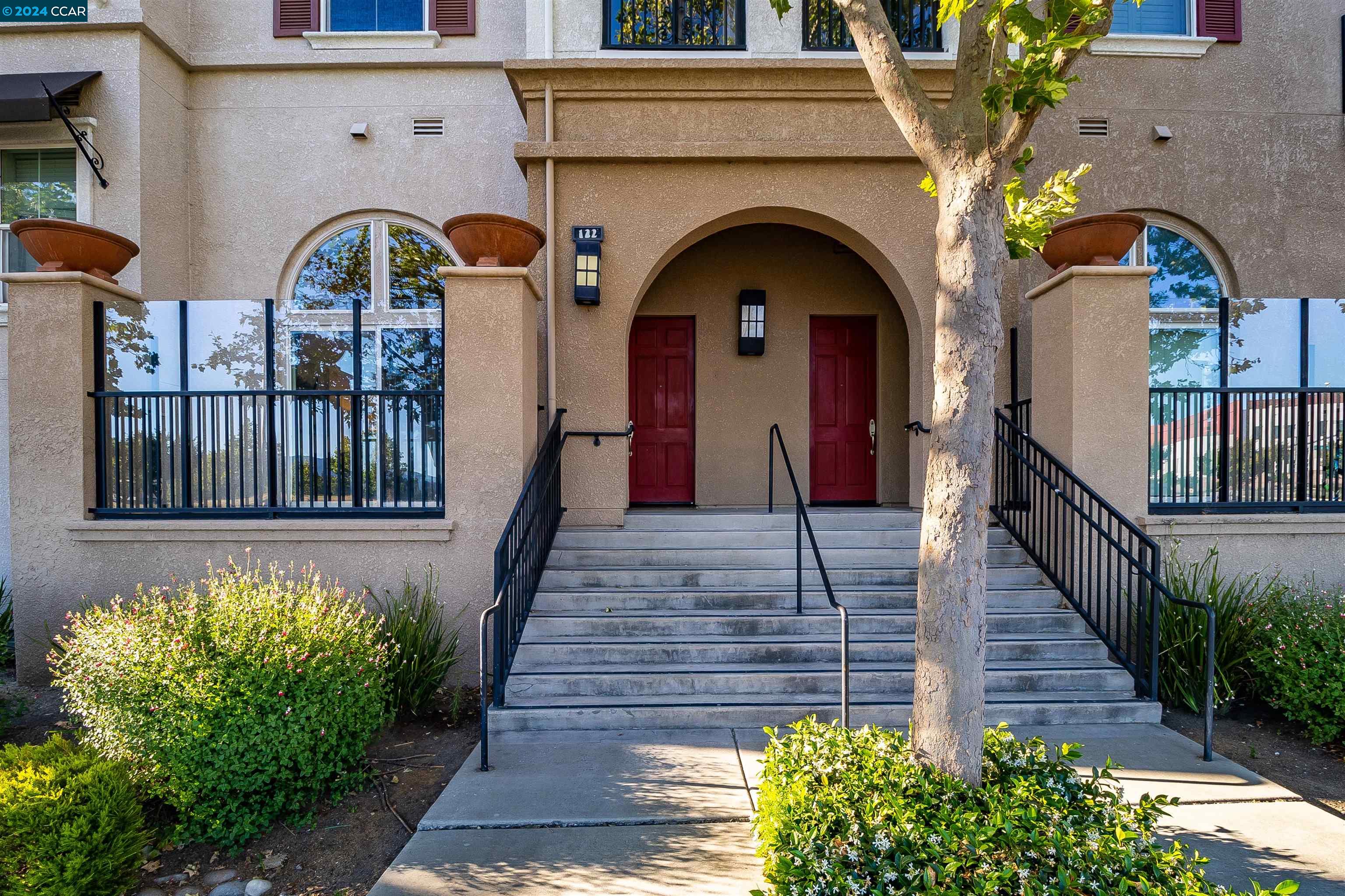 a front view of a house with garden