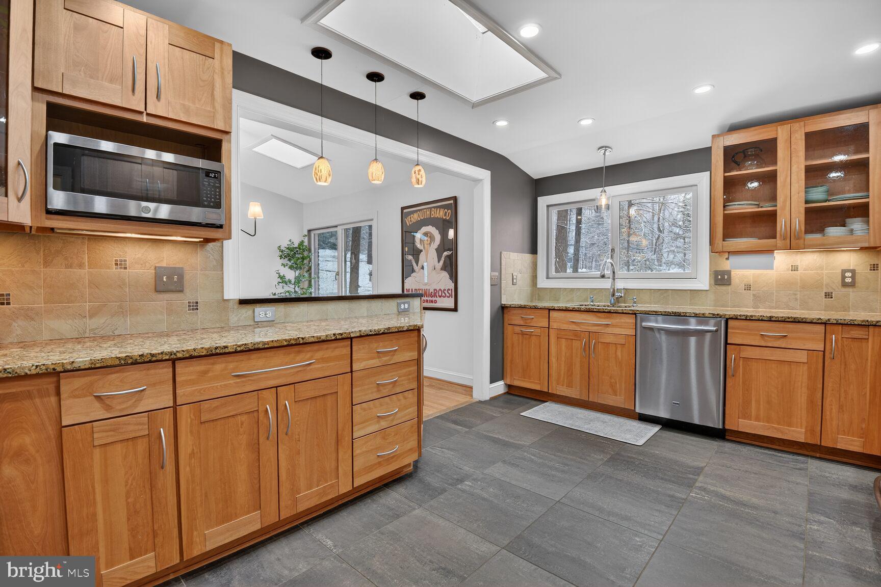 10209 Lloyd Road Potomac, MD 20854 - Photo 13 of 29 a large kitchen with stainless steel appliances granite countertop a stove and a sink