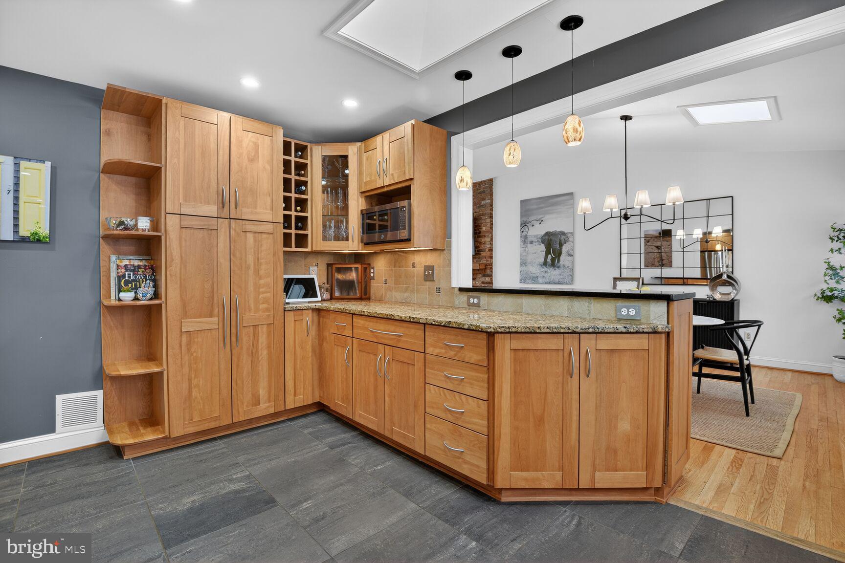 10209 Lloyd Road Potomac, MD 20854 - Photo 14 of 29 a kitchen with stainless steel appliances granite countertop a refrigerator and a sink