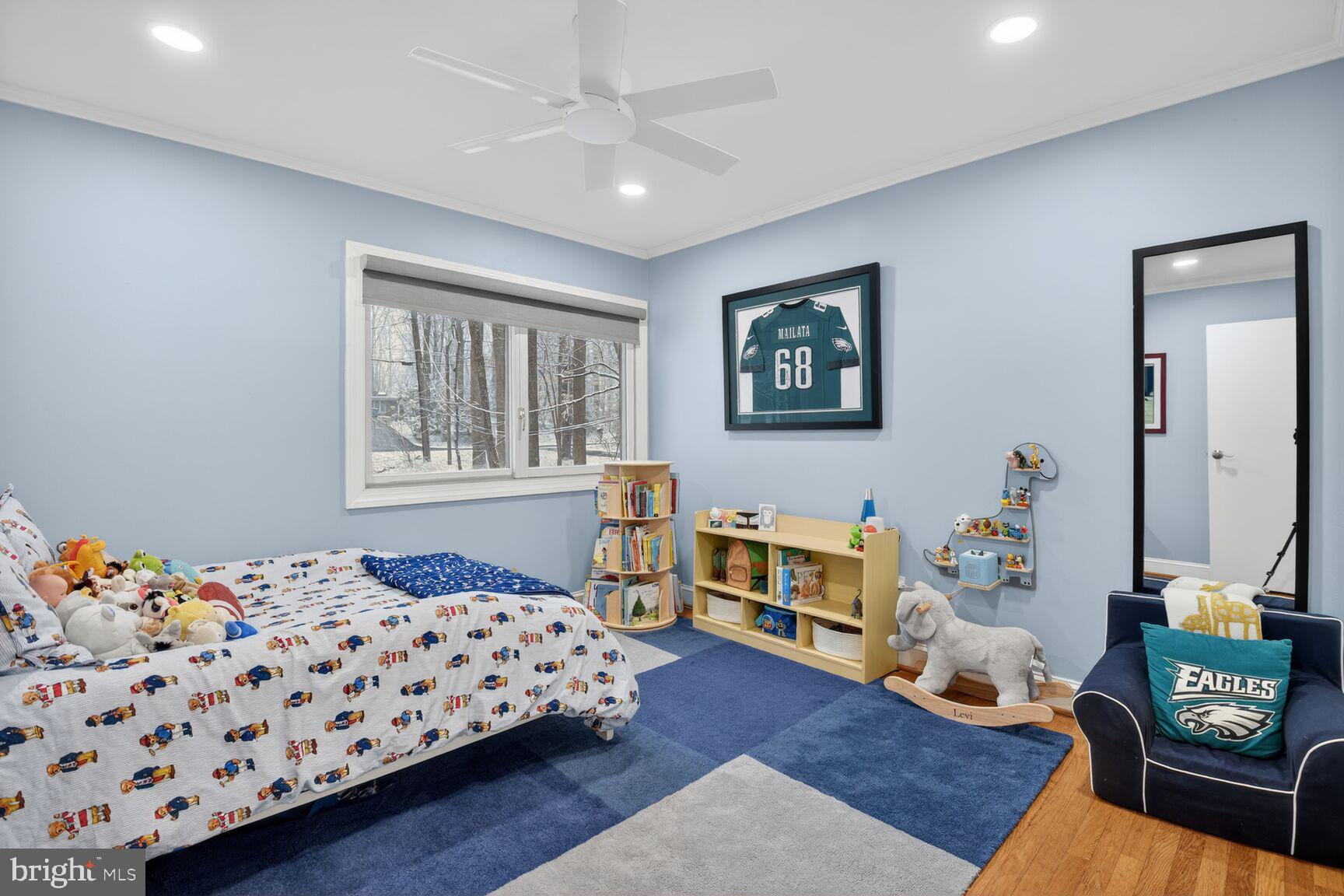 10209 Lloyd Road Potomac, MD 20854 - Photo 20 of 29 a bedroom with furniture and a wooden floor