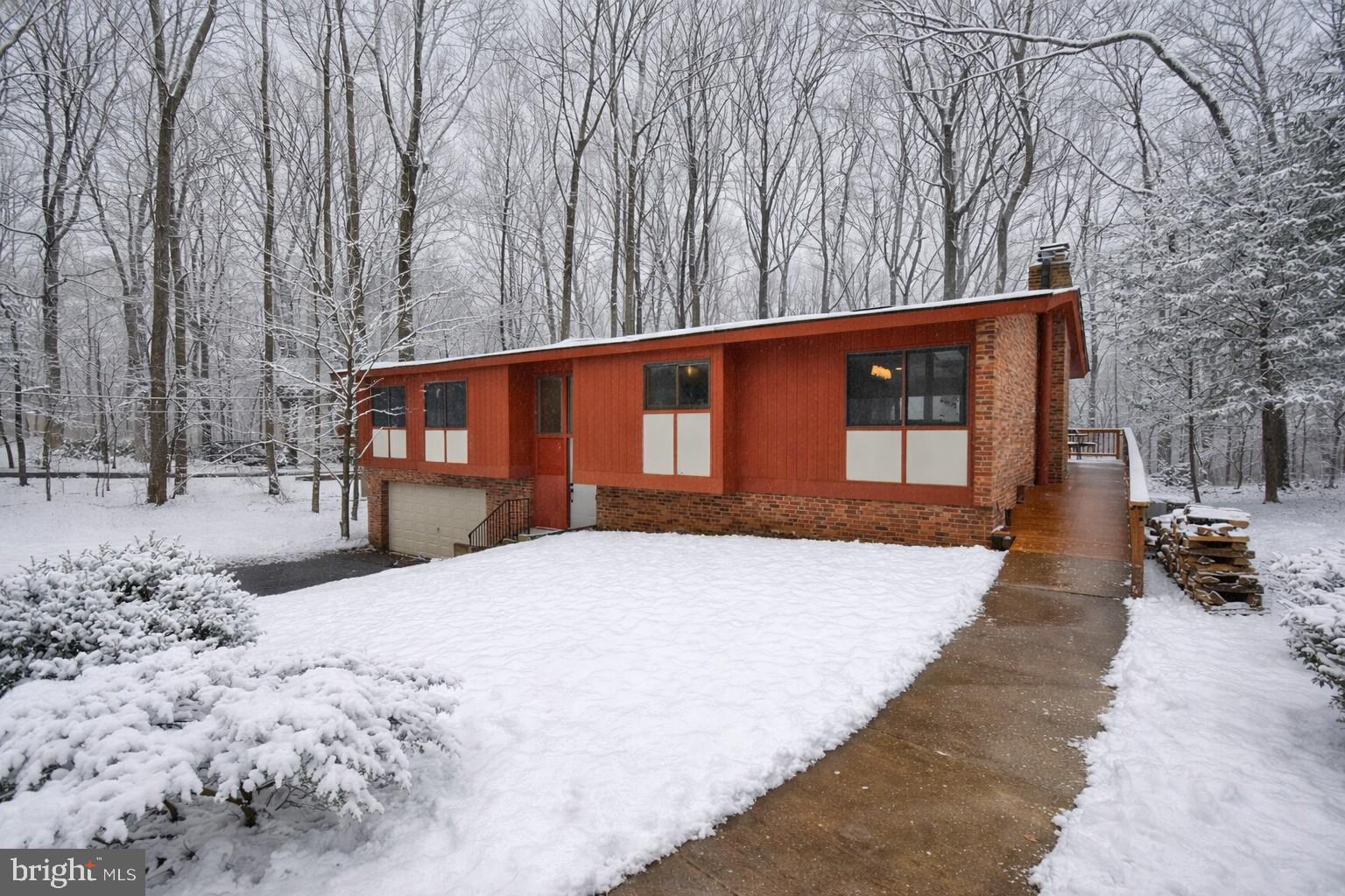 10209 Lloyd Road Potomac, MD 20854 - Photo 2 of 29 a backyard of a house with trees and outdoor space