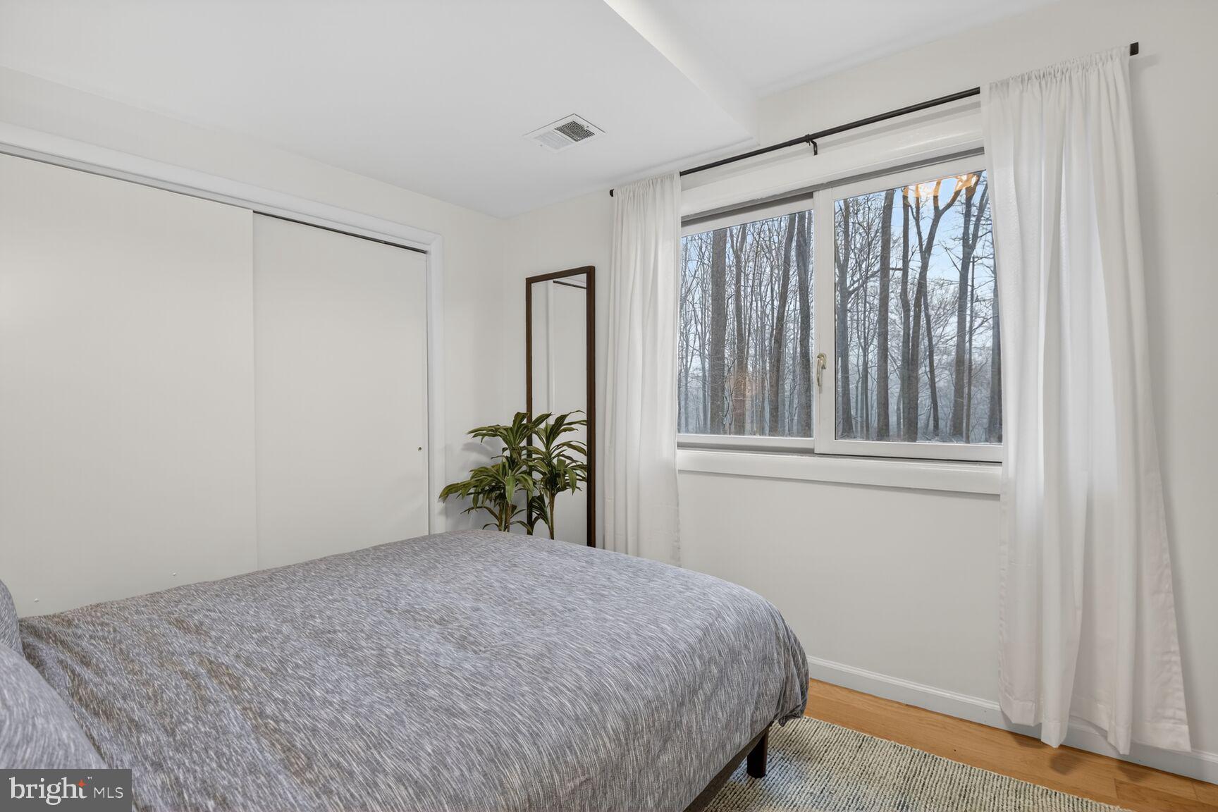10209 Lloyd Road Potomac, MD 20854 - Photo 23 of 29 a bedroom with a bed and a window