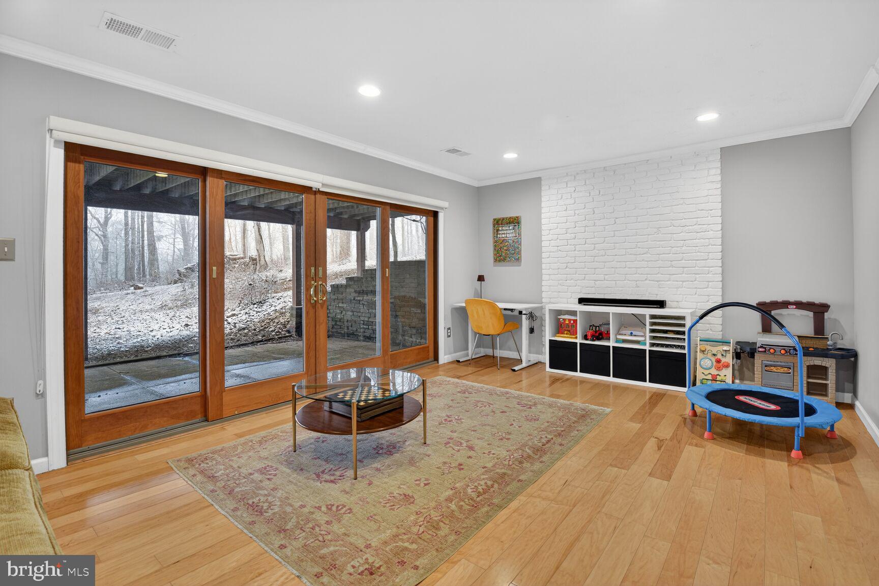10209 Lloyd Road Potomac, MD 20854 - Photo 25 of 29 a bedroom with furniture and a floor to ceiling window
