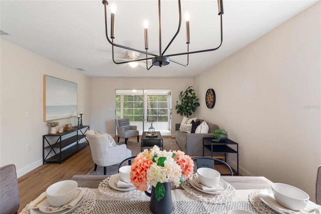 1950 Settlement Road, Unit 23 Venice, FL 34285 - Photo 11 of 33 a living room with furniture and flowers