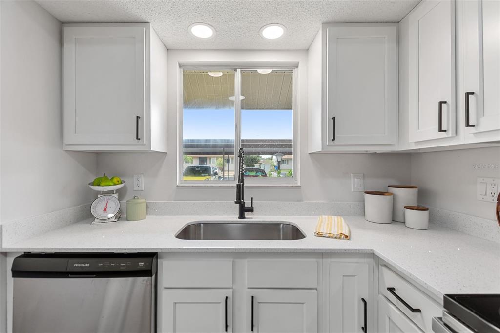 1950 Settlement Road, Unit 23 Venice, FL 34285 - Photo 12 of 33 a kitchen with a sink and cabinets