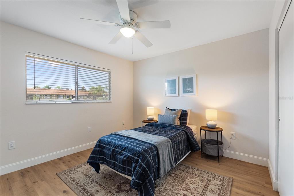 1950 Settlement Road, Unit 23 Venice, FL 34285 - Photo 19 of 33 a bedroom with a bed and a window