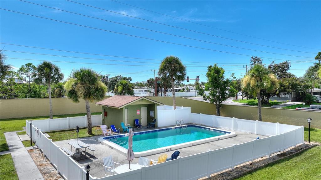1950 Settlement Road, Unit 23 Venice, FL 34285 - Photo 25 of 33 a view of a backyard with sitting area and furniture