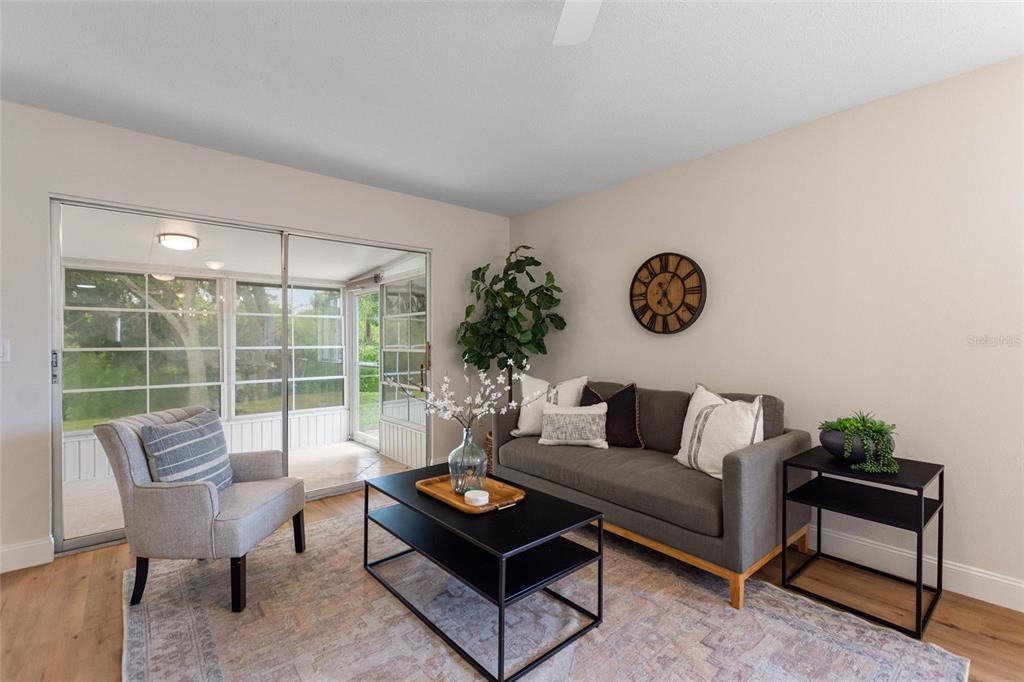 1950 Settlement Road, Unit 23 Venice, FL 34285 - Photo 8 of 33 a living room with furniture and a large window