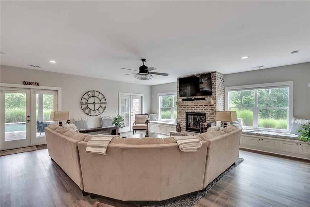 2503 Sugar Pike Road Canton, GA 30115 - Photo 126 of 134 a living room with fireplace furniture and a flat screen tv