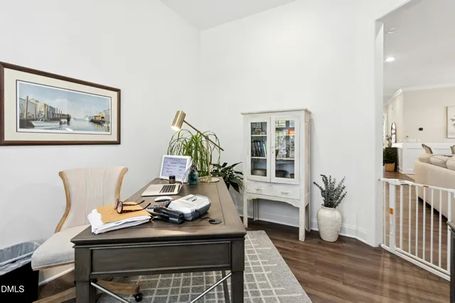 a living room with furniture a piano and a fireplace