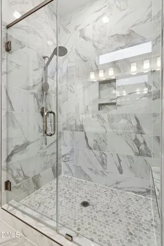 a bathroom with a sink double vanity and a mirror