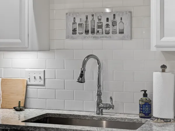 a kitchen with a stove and cabinets