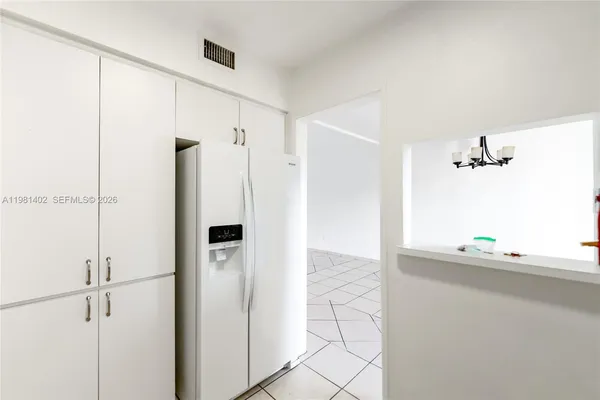 a bathroom with a shower and a sink