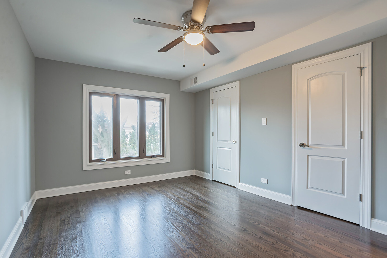1900 Brophy Avenue Park Ridge, IL 60068 - Photo 11 of 27 a view of an empty room with wooden floor and a window
