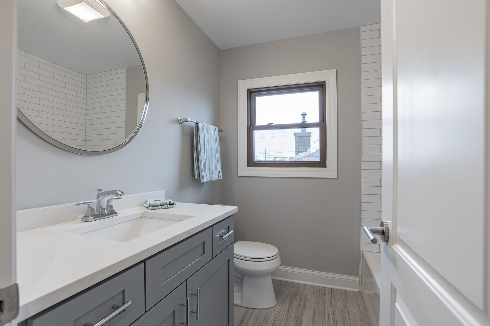 1900 Brophy Avenue Park Ridge, IL 60068 - Photo 17 of 27 a bathroom with a toilet a sink a mirror and a window
