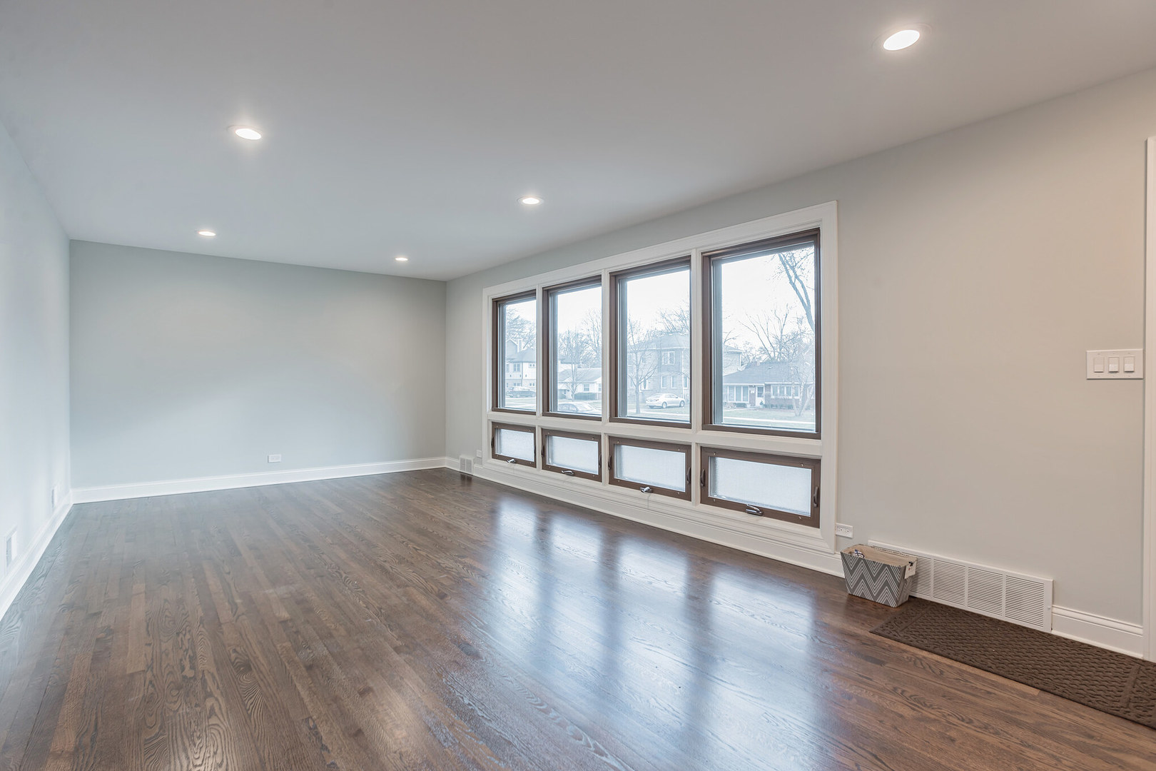 1900 Brophy Avenue Park Ridge, IL 60068 - Photo 3 of 27 a view of an empty room with wooden floor and a window