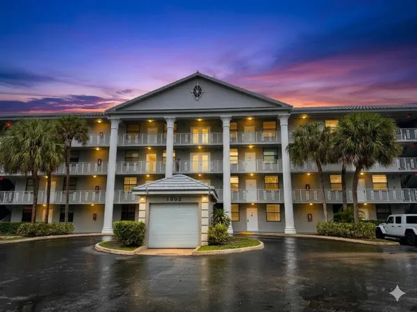 a kitchen with stainless steel appliances a stove a microwave and a refrigerator