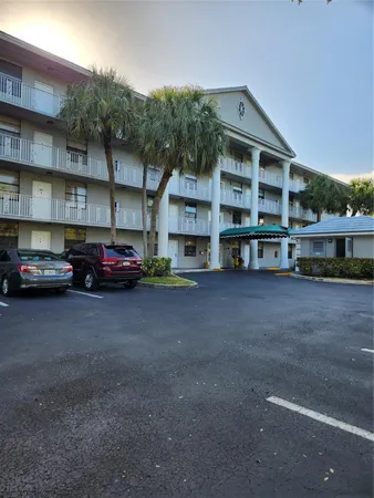 a view of a car parked in front of a building