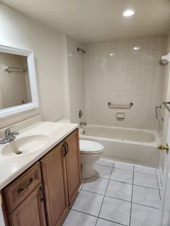 a bathroom with a sink a toilet and a bathtub