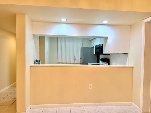 a view of kitchen with cabinets and wooden floor