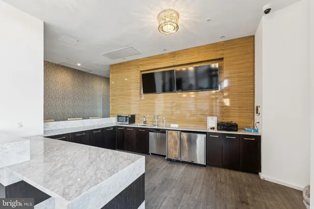 a kitchen with a sink and a stove