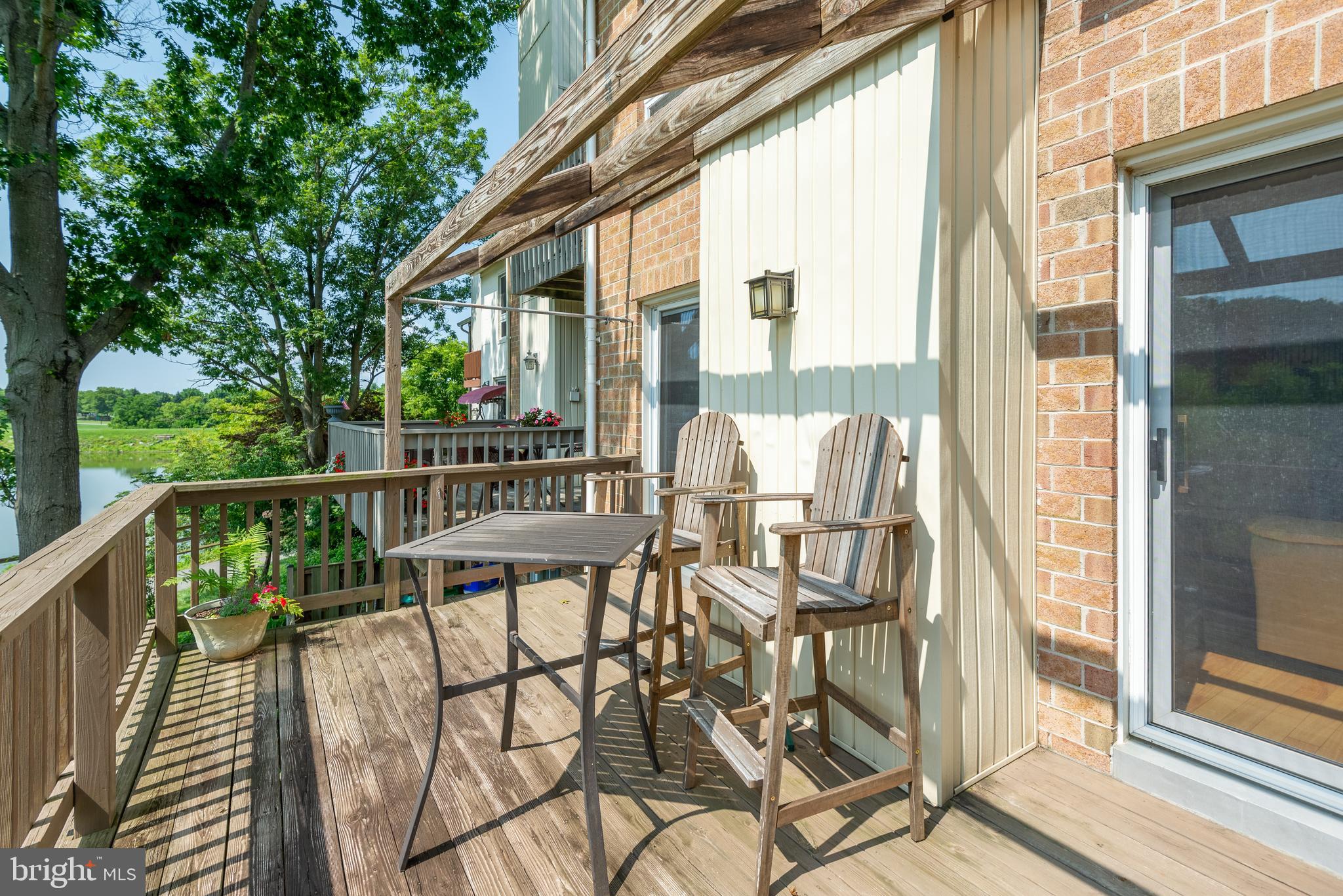 7261 Dockside Lane Columbia, MD 21045 - Photo 12 of 68 a view of a two chairs and table in the balcony