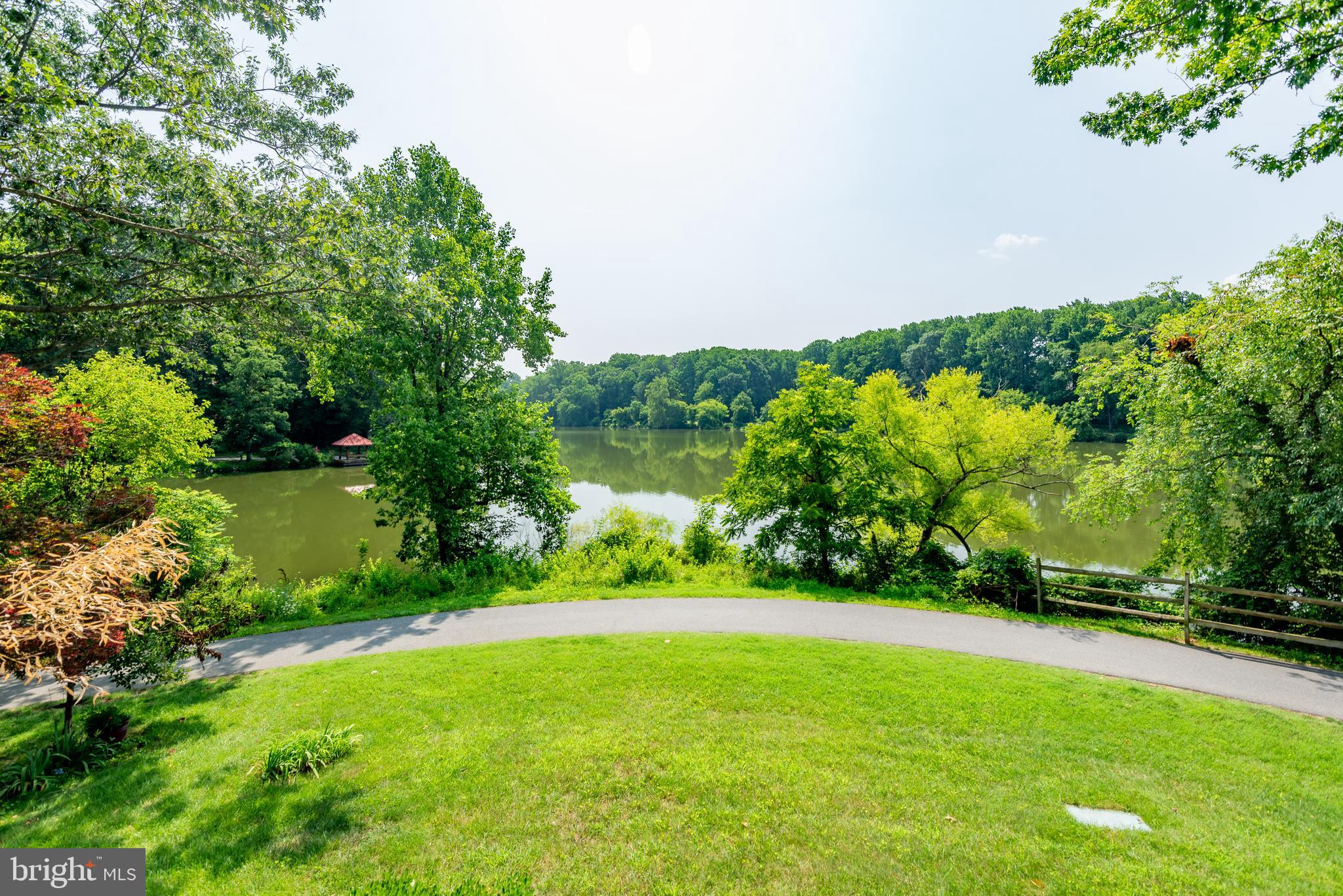 7261 Dockside Lane Columbia, MD 21045 - Photo 14 of 68 a view of a garden with a lake