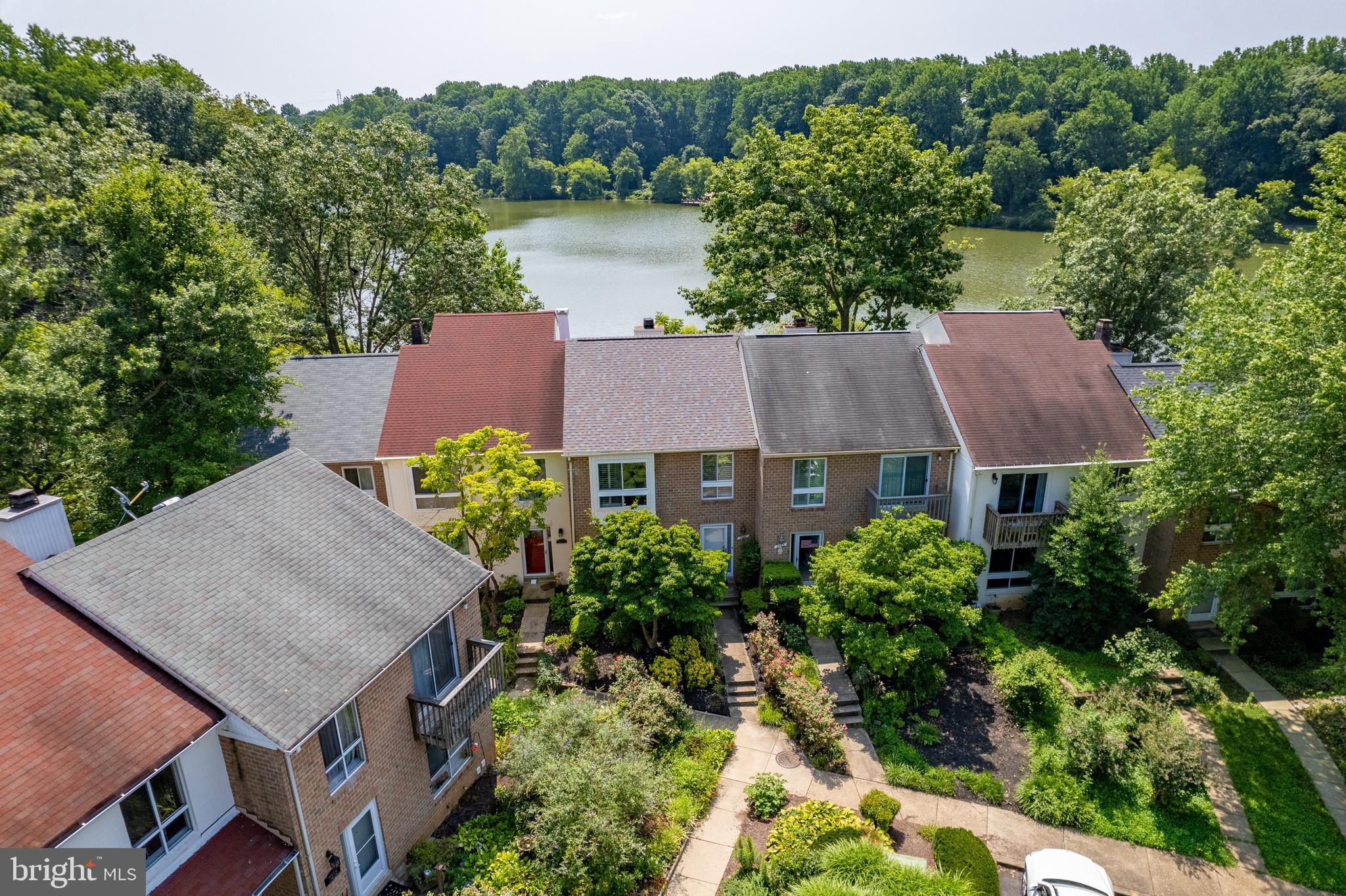 7261 Dockside Lane Columbia, MD 21045 - Photo 2 of 68 an aerial view of a house with a garden and a yard