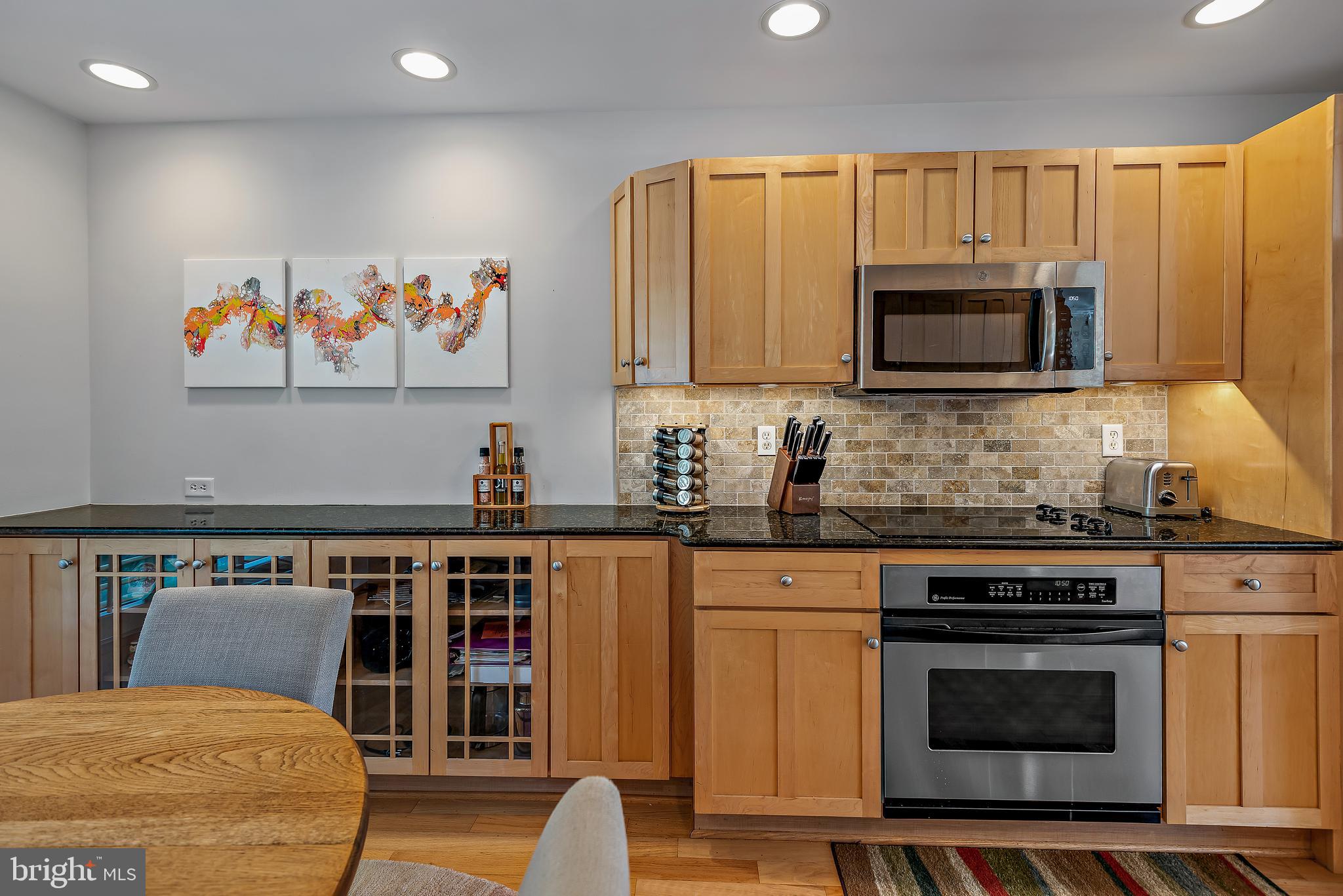 7261 Dockside Lane Columbia, MD 21045 - Photo 22 of 68 a kitchen with stainless steel appliances a stove a microwave a sink and cabinets