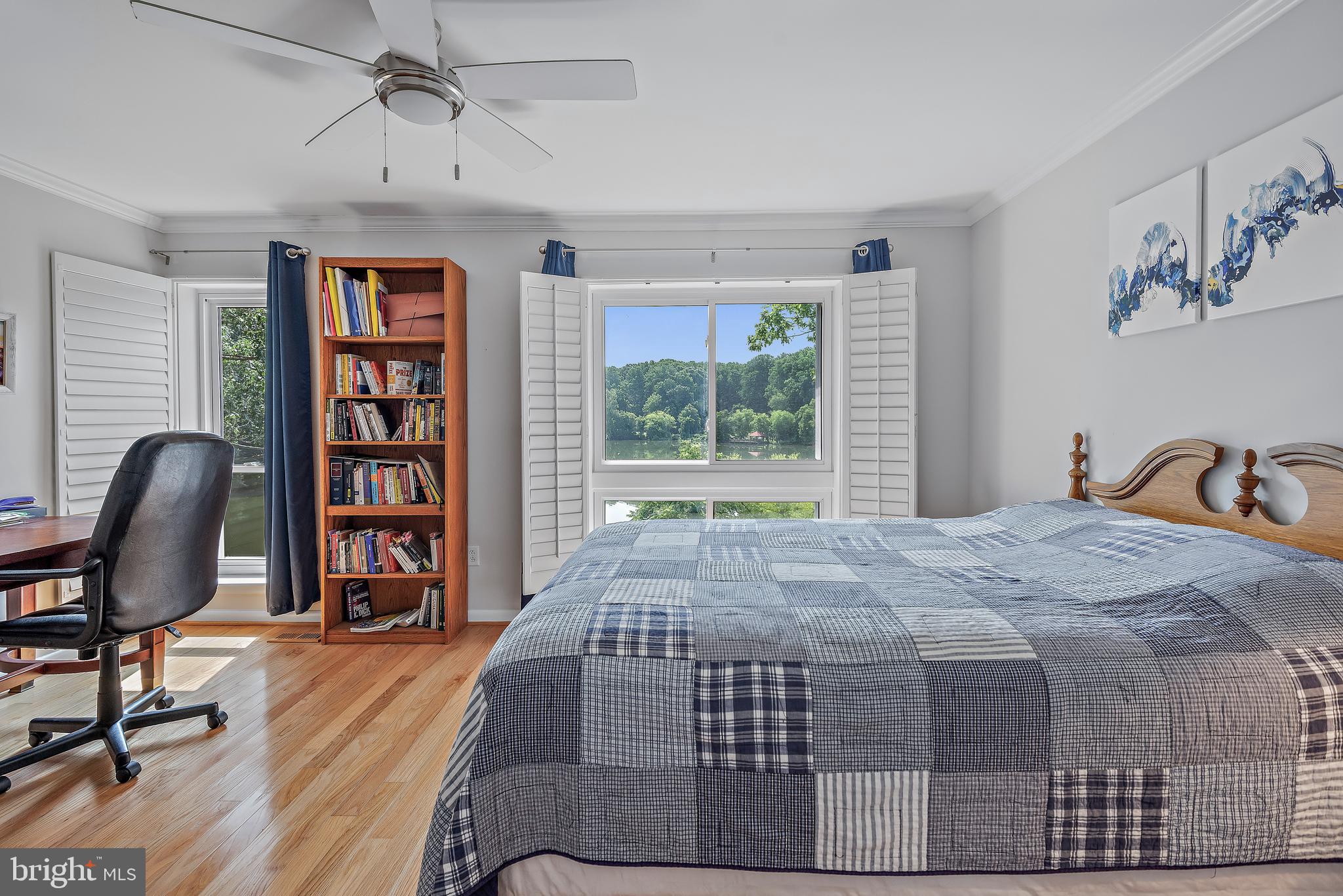 7261 Dockside Lane Columbia, MD 21045 - Photo 29 of 68 a bedroom with a bed a chair and a large window