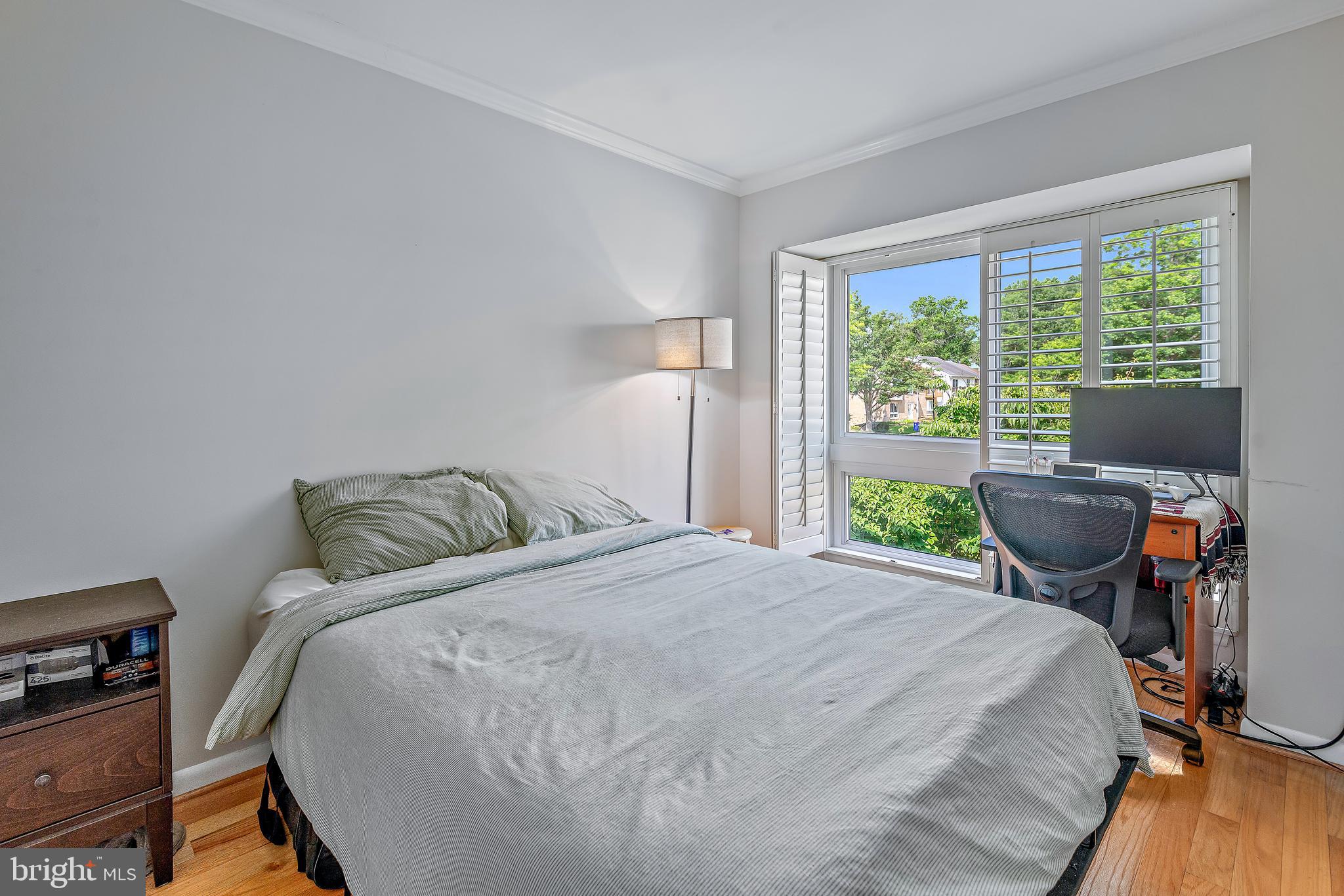 7261 Dockside Lane Columbia, MD 21045 - Photo 40 of 68 a bed sitting in a bedroom next to a window