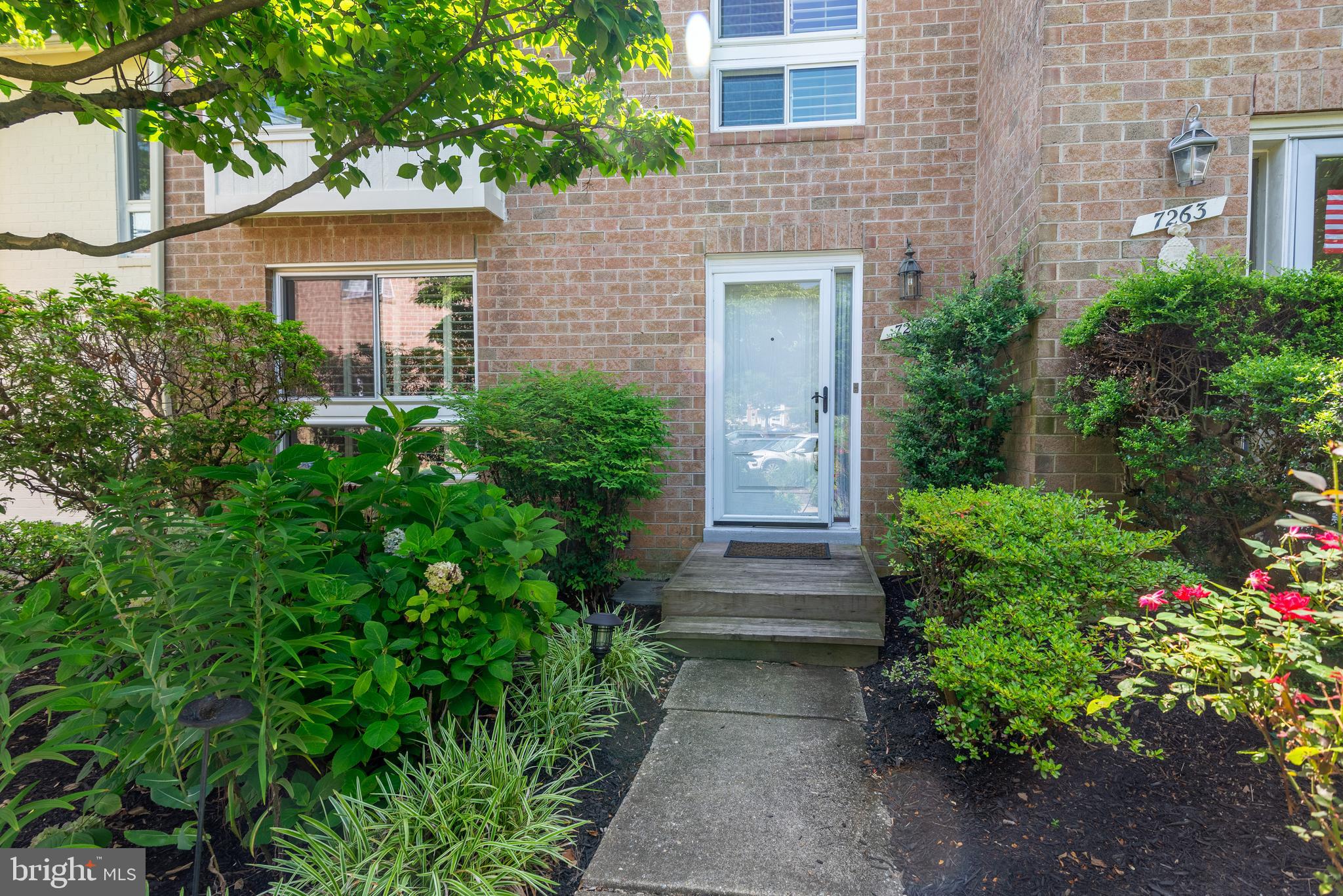 7261 Dockside Lane Columbia, MD 21045 - Photo 4 of 68 a view of a pathway in front of house with potted plants