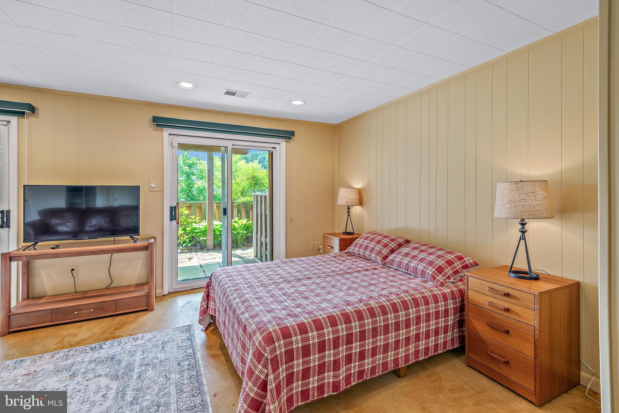 7261 Dockside Lane Columbia, MD 21045 - Photo 49 of 68 a bedroom with a bed and a flat screen tv