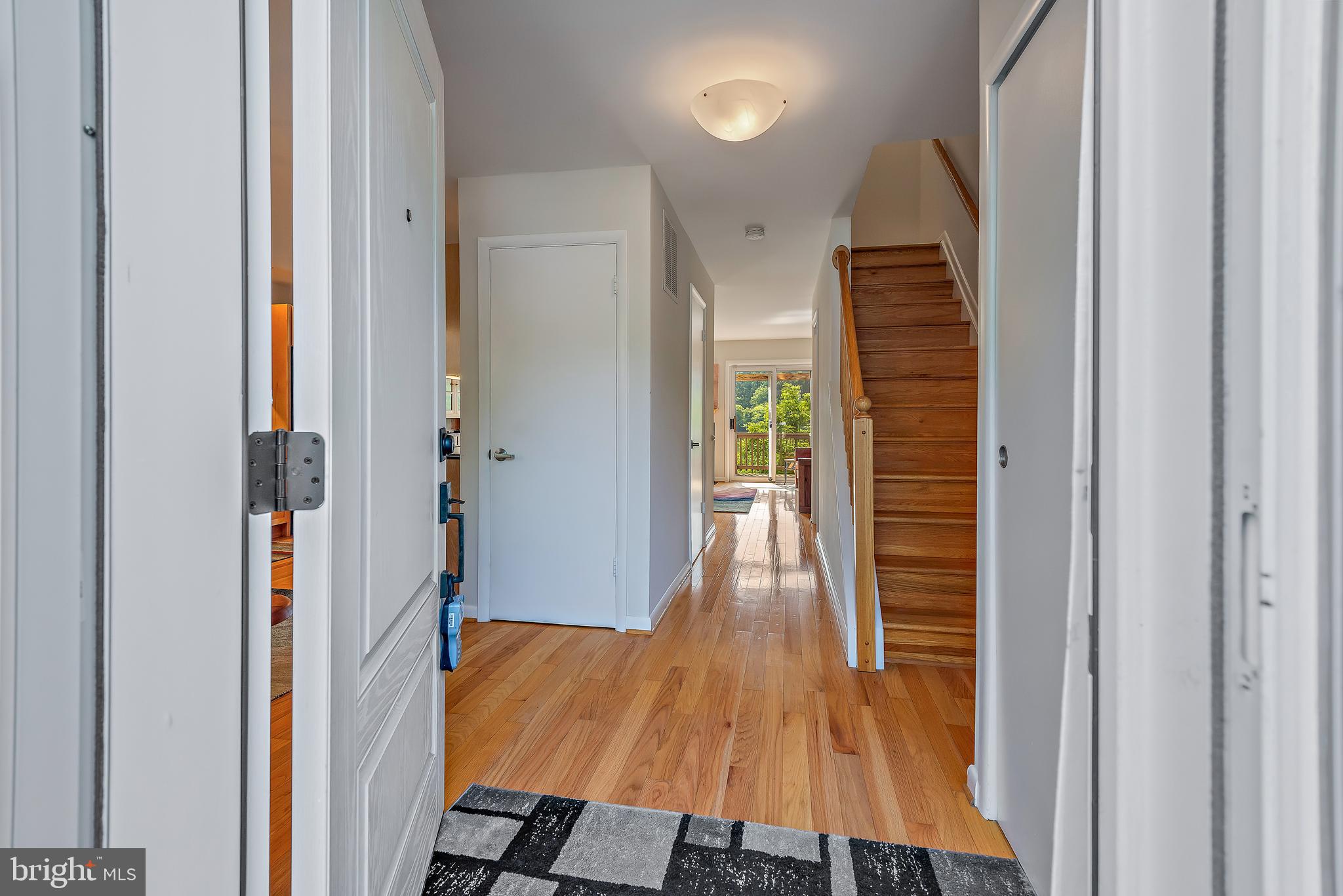 7261 Dockside Lane Columbia, MD 21045 - Photo 5 of 68 a view of a hallway with wooden floor and staircase