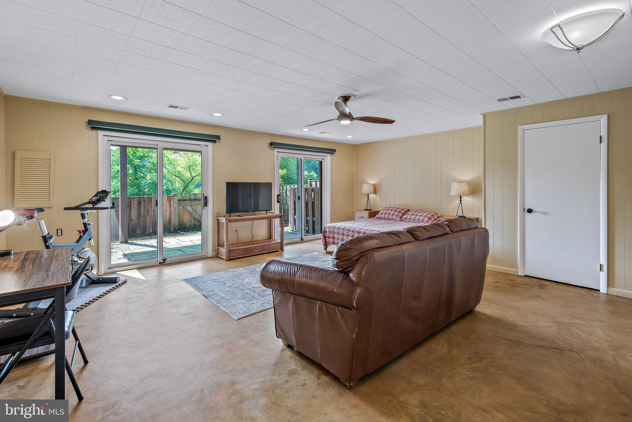 7261 Dockside Lane Columbia, MD 21045 - Photo 52 of 68 a living room with furniture window and a flat screen tv