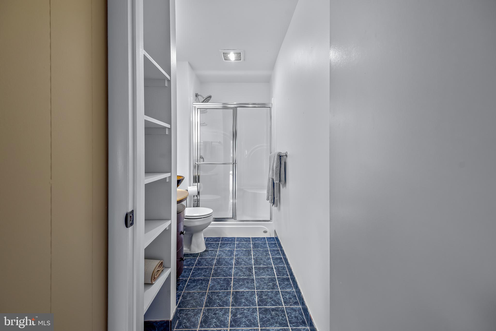 7261 Dockside Lane Columbia, MD 21045 - Photo 54 of 68 a bathroom with a glass door shower