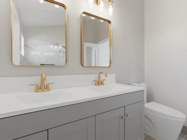 a bathroom with a toilet a sink and mirror