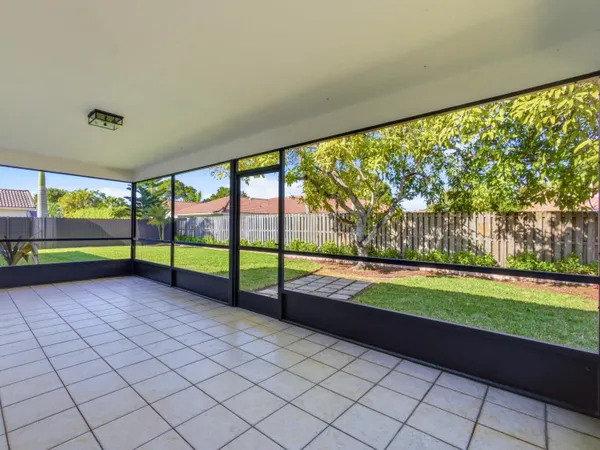 a view of a garden with an outdoor seating