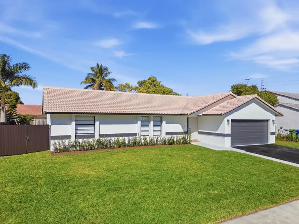 a house view with a garden space