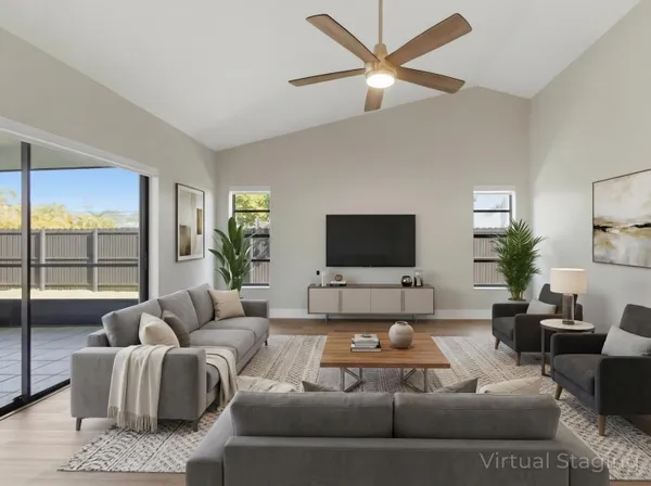 a living room with furniture and a flat screen tv